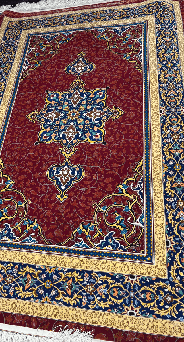 Authentic Persian Silk and Wool Rug - Partial side view highlighting the fine craftsmanship and vibrant patterns of a Persian area rug, showcasing floral designs and medallion motifs.